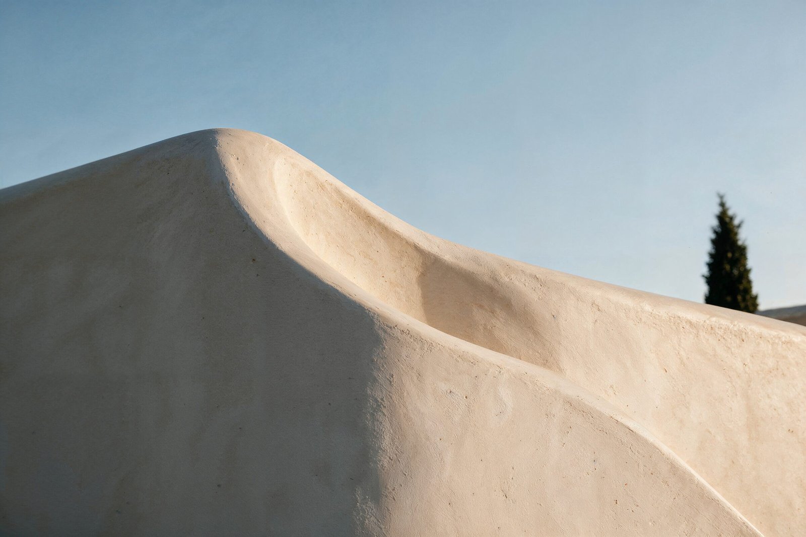 Sculpted parapet curve at dusk